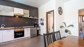 Villa | Private kitchen | Oven, electric kettle, toaster
