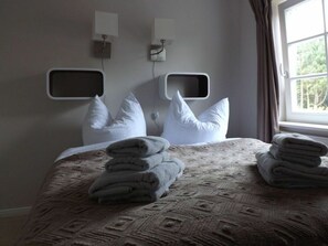 Cozy retreat with a neatly made bed and clean design.