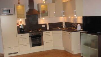 Apartment | Private kitchen | Oven, electric kettle, toaster