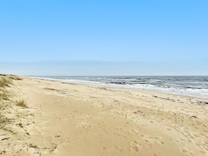 A beach with sand and waves. - 6 Person Holiday Home in Yngsjo (Yngsjo)