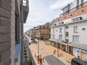 A street view with buildings, a pedestrian area, and a clear sky. - Family Holiday Home, Westende (Middelkerke)
