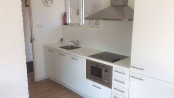 Apartment | Private kitchen | Oven, electric kettle, toaster