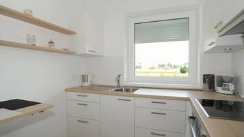 Apartment | Private kitchen | Oven, electric kettle, toaster