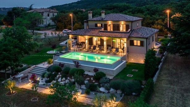 A two-story house with a swimming pool, outdoor seating area, and a well-maintained garden. - Villa With Pool Surrounded by Woods in Labin (Labin)