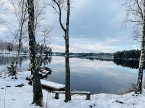 A tranquil lake surrounded by trees and a wooden dock. - 4 Person Holiday Home in Aseda (Åseda)
