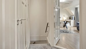 A modern interior with a hallway leading to a living area. - Holiday Home With a Garden and Parking (Drachten)