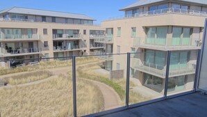 A modern building with multiple balconies and large windows. - Nieuwpoort Beach Getaway (Koksijde)