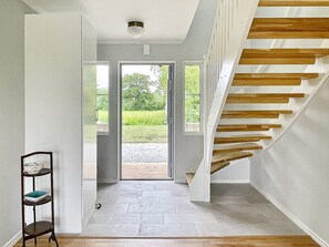 A modern interior with a staircase leading to an outdoor area. - 5 Star Holiday Home in Lottorp (Löttorp)