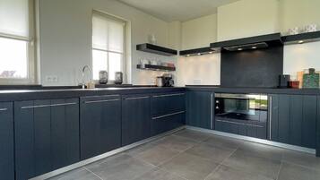 Villa | Private kitchen | Fridge, electric kettle