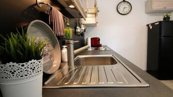 Apartment | Private kitchen | Oven, electric kettle, toaster