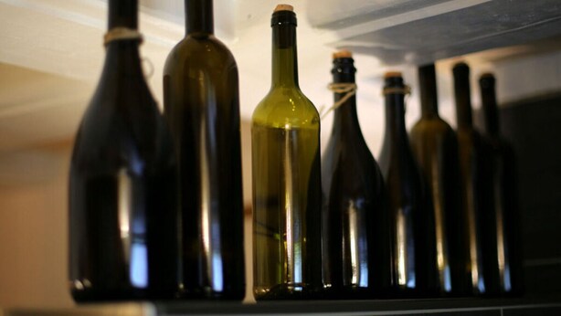 A row of wine bottles on a shelf. - Ferieheisel - Everything, Except Usually! (Bad Bergzabern)