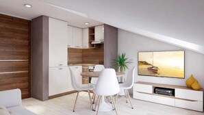 Een moderne woonkamer met een eetgedeelte, een keuken en een aan de muur bevestigde televisie.