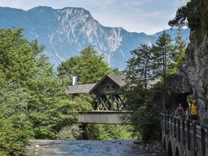 A wooden house on stilts with a view of mountains in the background. - Chalet in Kundl Near Ski Juwel (Kundl)