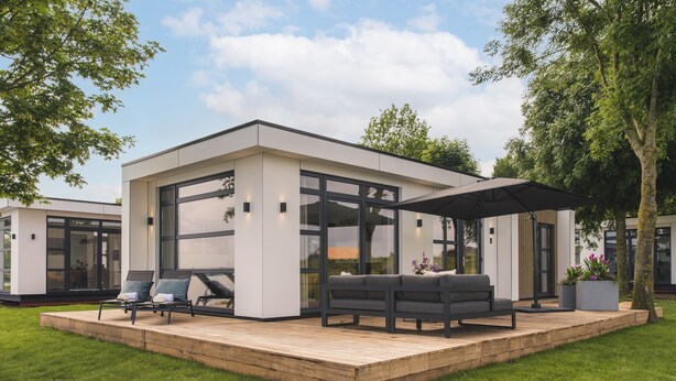 A modern house with a deck, large windows, and outdoor seating. - Holiday Home in Netherlands With Water Views (Maurik)