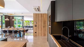 Villa | Private kitchen | Fridge, microwave, oven, stovetop