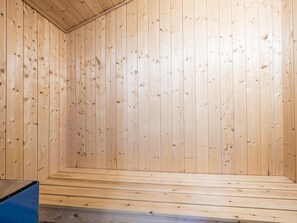 A room with wooden walls and a bench. - 4 Person Holiday Home in Hemmet (Hemmet)