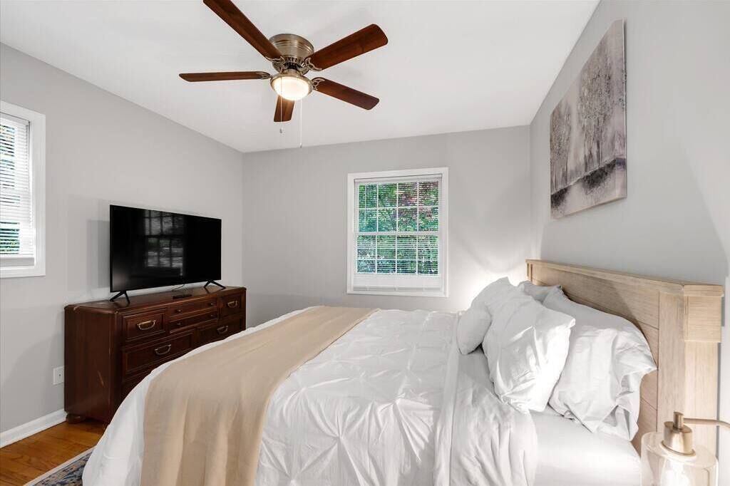 Bedroom #3. Upstairs king size bed with flat screen TV & dresser