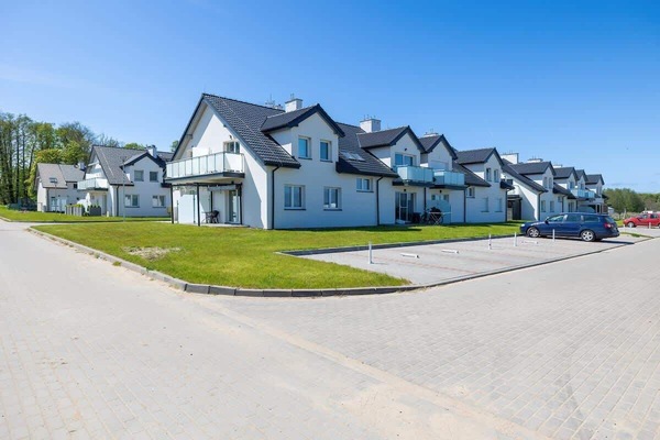 Another view of the modern houses from a different angle emphasizes the architectural consistency of the estate.