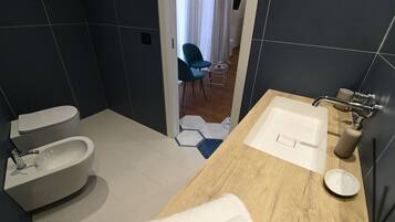 Deluxe Room, City View | Bathroom | Hair dryer, slippers