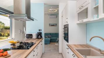 Villa | Private kitchen | Oven, electric kettle, toaster