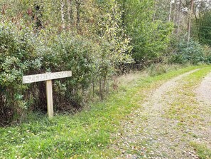 A wooden signpost with the number 52 and the name 'Fredriksson' indicating a location.