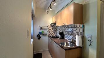 Fridge, stovetop, dining tables