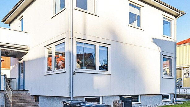 A two-story residential building with a flat roof, large windows, and a visible staircase leading to the entrance. - 4 Star Holiday Home in Lysekil (Lysekil)