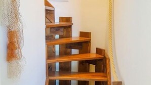 A wooden staircase with a simple design and a rope handrail. - Apartments Vela Stiniva - Two Bedroom Apartment With Sea View and Terrace (Jelsa)