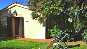 A house with a door, a small porch, and a lawn. - Farmhouse With Spacious Garden and Pool (Asciano)