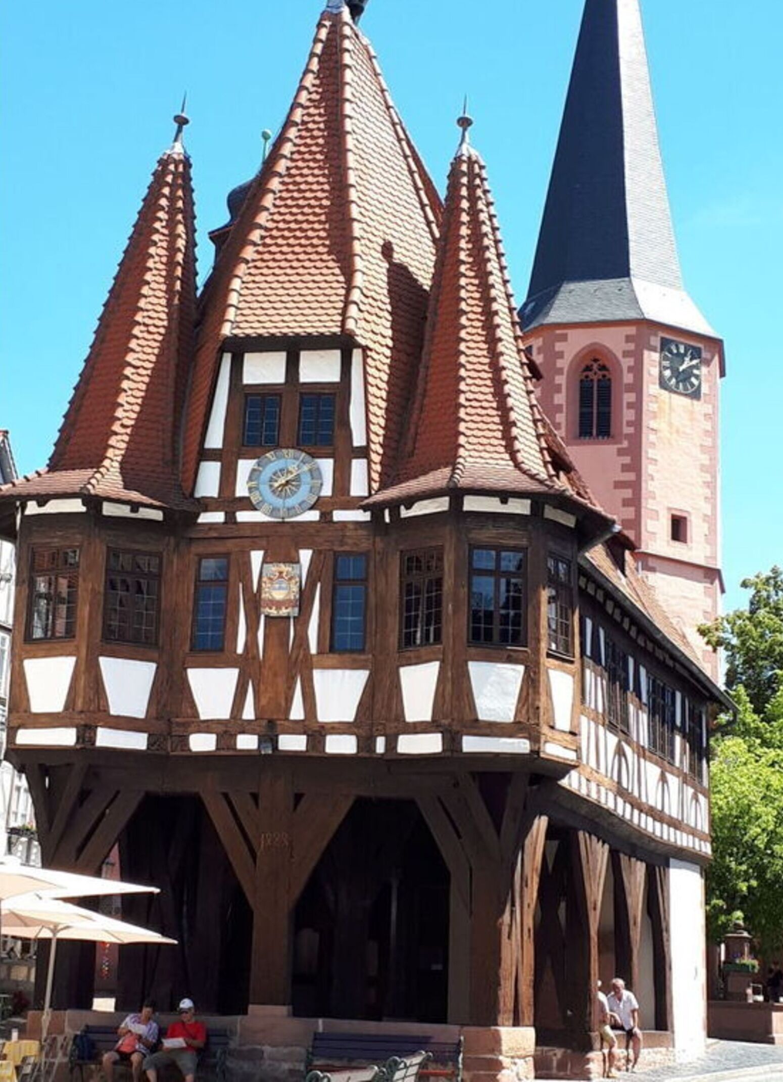 A traditional half-timbered building with a clock tower.