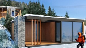 A modern ski lodge with a glass facade, wooden interior, and a stone exterior. - Modern Holiday Home With sun Shower (Winterberg)