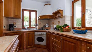 Villa | Private kitchen | Oven, toaster