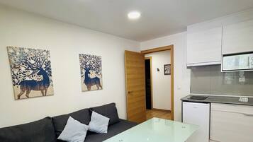 Family Apartment, Mountain View | Living area | 27-inch flat-screen TV with digital channels