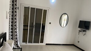 Comfort Room, Pool View | Laptop workspace, WiFi (free), individually decorated - Hôtel Camille (Nguekhokhe)