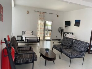 Family Apartment, Pool View | Living area - Hôtel Camille (Nguekhokhe)
