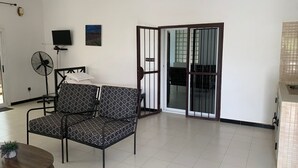 Family Apartment, Pool View | Living area - Hôtel Camille (Nguekhokhe)