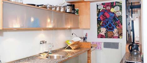 Microwave, oven, dishwasher, dining tables