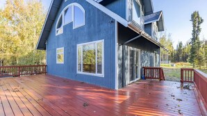 A two-story house with a red deck and a large window. - Sterling Hideout on the Kenai Peninsula (Sterling)