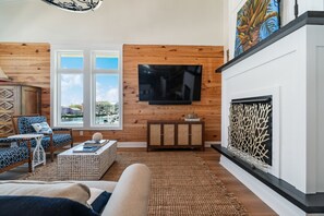 Smart-tv, eldstad, tv-spel och bordsfotboll