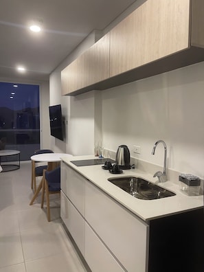 Fridge, microwave, stovetop, coffee/tea maker