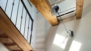 A wooden staircase with a metal railing, a ceiling fan, and a radiator. - Beautiful place  on the beach with gorgeous views, close to the restaurants. (Vinišce)