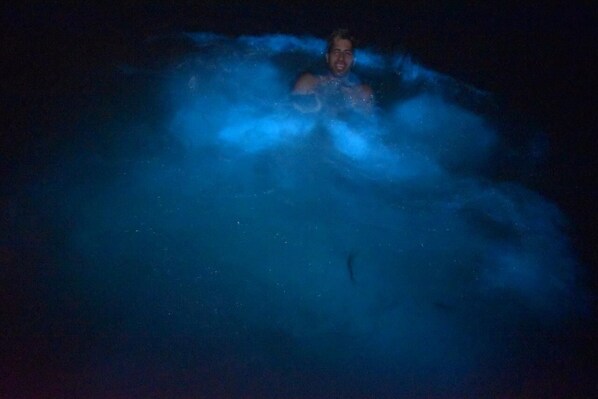 A person in a dark environment with blue lighting, possibly in a pool or water feature. - Reddie Vacation Home at Stonebrook Vista Trelawny (Florence Hall Village)