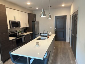 Fridge, microwave, stovetop, cookware/dishes/utensils