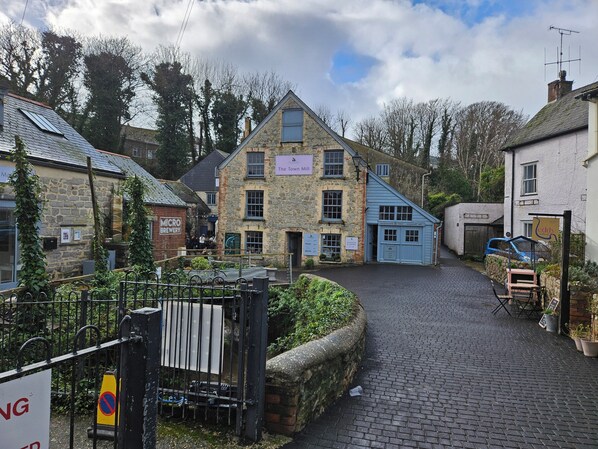 A stone building with a sign reading "The Town Mill." - Set in the heart of Lyme Regis in the conservation area of the old town (Lyme Regis)