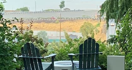 A shady retreat within a flower garden, with a boutique hotel feel. Close in