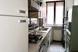 Fridge, oven, dining tables