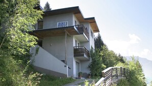 A modern building with a sign reading "BIKE" and a wooden staircase leading up to it. - Apartment in Aschau Near Ski Lift Kaltenbach (Aschau Im Zillertal)