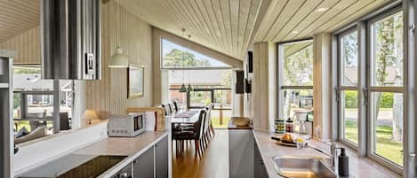 Fridge, stovetop, dishwasher, coffee/tea maker