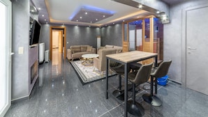 A modern interior with a dining area, sofas, and a kitchen. - Holiday Home in Verviers With Sauna (Verviers)