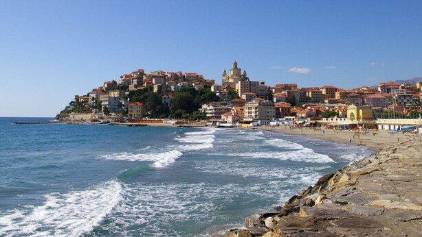 A coastal town with buildings on a hillside overlooking the sea. - Holiday Apartment Monte Faudo (Cipressa)